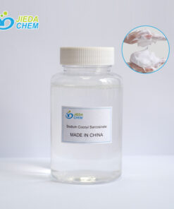 The transparent liquid Sodium lauroyl sarcosinate in the small bottle is poured into the beaker